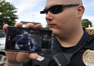 A police officer wears a bodycam